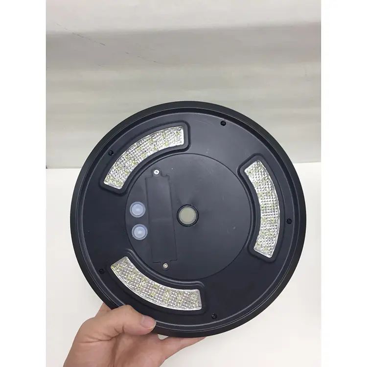underside of a solar flagpole light head showing LED segments and switch