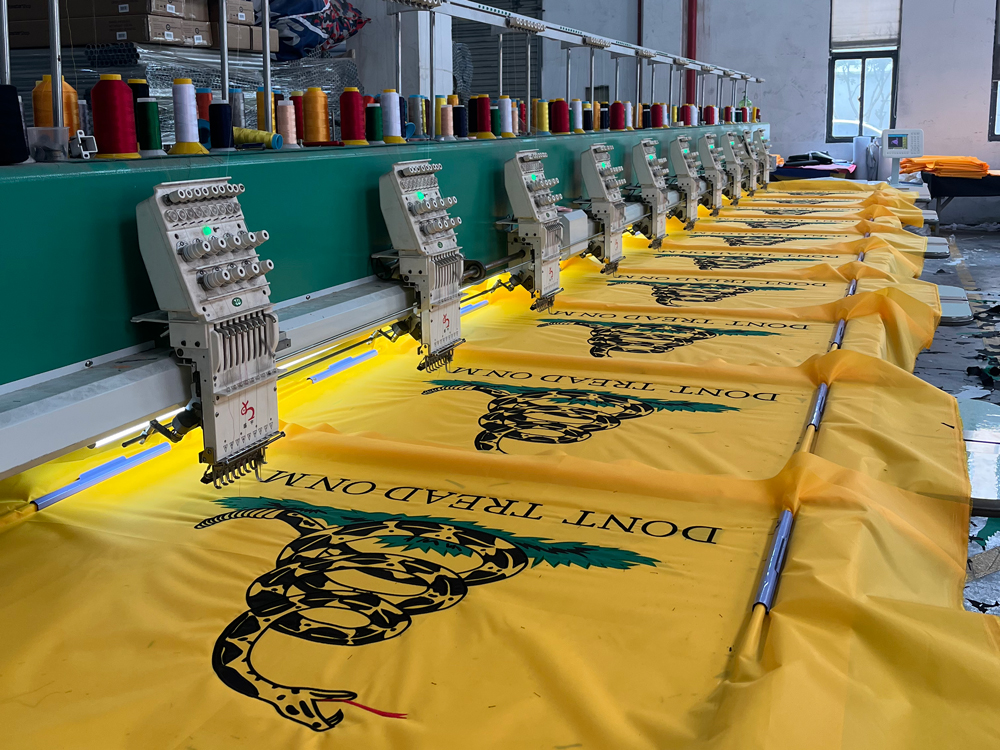 Multi head embroidery machine embroidering flags